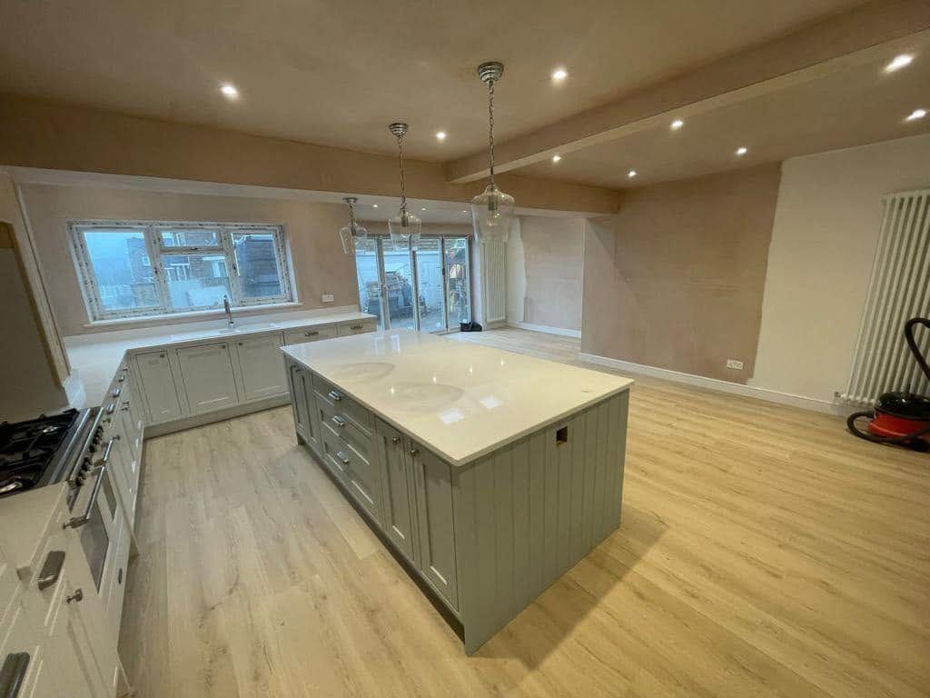 Open-plan kitchen with an island where a conservatory once stood